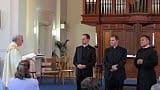 Paulist President Father Michael B. McGarry (left) examines the three candidates before they make their final profession in the Paulist community. (Photo credit: Bruce Byers, brucebyers.com)