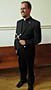 Richard R. Andre, CSP stands with his Paulist Mission Cross. (Photo credit: Bruce Byers, brucebyers.com)