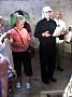 Father Wayne Ball gives an explanation about the Chapel of the Ascension. The rock on the floor is said to bear the footprint of Jesus as he ascended into heaven.