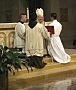 Auxiliary Bishop Francisco Gonzalez Valer, SF, of the Archdiocese of Washington, D.C., accepts the promise of obedience of Dat Q. Tran, CSP, as Mr. Tran is ordained a transitional deacon.