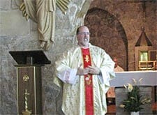 Father Larry Rice, CSP, delivers the homily during Mass at the Crusaders Chapel of the Church of the Holy Sepulchre.