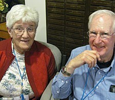 Marian Howard, a Paulist Associate and director of adult faith formation at the Paulist-run Immaculate Conception Church in Knoxville, chats with Paulist treasurer Father Jim Haley before dinner during the preassembly meeting in New York.