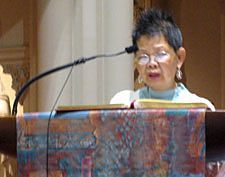 Carol Cheung, a parishioner of  Holy Family Chinese Mission, reads the second reading in Cantonese during a joint Mass with Old St. Mary's Cathedral Aug. 30.