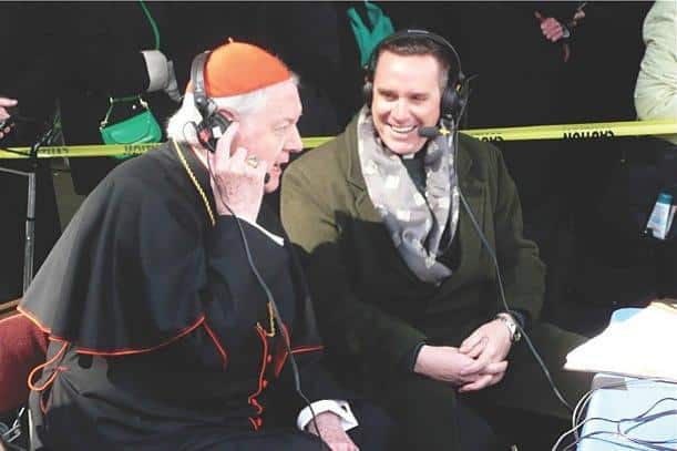 Edward Cardinal Egan and Father Dave Dwyer, CSP, broadcasting “The Busted Halo Show."&nbsp;