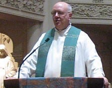 Father Charles Kullmann, CSP, pastor of Old St. Mary's Cathedral in San Francisco, says a few words to the congregation after a joint Mass with Holy Family Chinese Mission Aug. 30.
