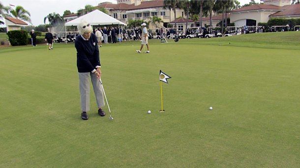 Participants perfect their putting skills before the shotgun start of the Paulist Open.