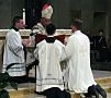 Rev. Mr. Richard R. Andre, CSP, is presented with the Book of Gospels, closely associated with the order of deacons, during Rev. Mr. Andre's diaconal ordination. (Photo credit: Bruce Byers, brucebyers.com)