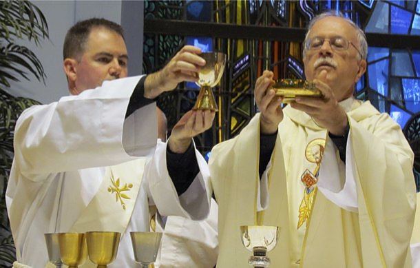 Paulist Father Michael McGarry (right) and Deacon Tom Gibbons, CSP, lead the celebration of Mass at Holy Cross Church in Vero Beach after the conclusion of the Paulist Open.