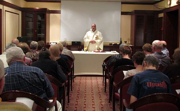 Father Larry Rice, CSP, the Paulist pilgrims and other passengers aboard the Norwegian Sun cruise ship celebrate Mass during Paulist Pilgrimage 2012.