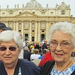 With St. Peter's Basilica as a backdrop, Father Paul Robichaud, CSP, stands with Cathy Hoekstra and Shirley Zeitter (left), pilgrims from Grand Rapids, Mich., as they await the appearance of the Holy Father for his weekly general audience.