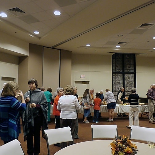 Parishioners enjoy refreshments and conversation in the Linda Finn Family Life Center at St. Paul the Apostle.