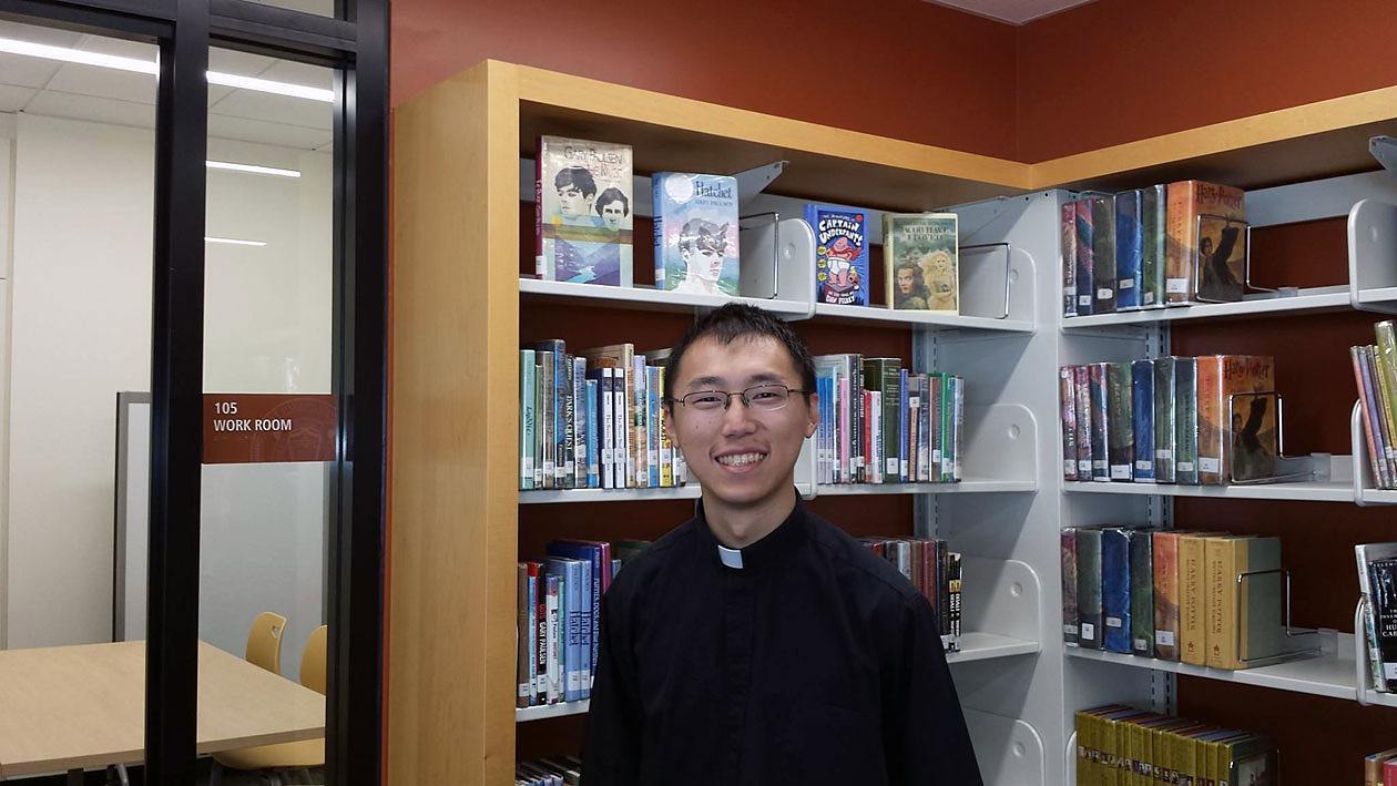 Father Jimmy Hsu, CSP, visits the media center in the new buildings at St. Paul the Apostle School in Los Angeles.