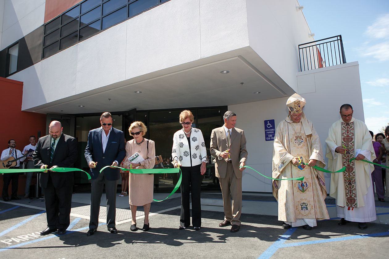 The ribbon is cut for officially opening the new Hilton Learning Center and the McCarthy Gymnasium at St. Paul the Apostle School in Los Angeles. Pictured are Richard Billups, principal of St. Paul the Apostle School (far left); Rick Caruso of the Caruso Family Foundation; Sister Stella Maria Enright, DMJ, former principal; Kathleen McCarthy-Kostlan of the Thomas & Dorthy Leavey Foundation; Steven Hilton of the Conrad N. Hilton Foundation; Auxiliary Bishop Edward Clark of the Archdiocese of Los Angeles; and Father Eric Andrews, CSP, president of the Paulist Fathers. (Courtesy St. Paul the Apostle School)