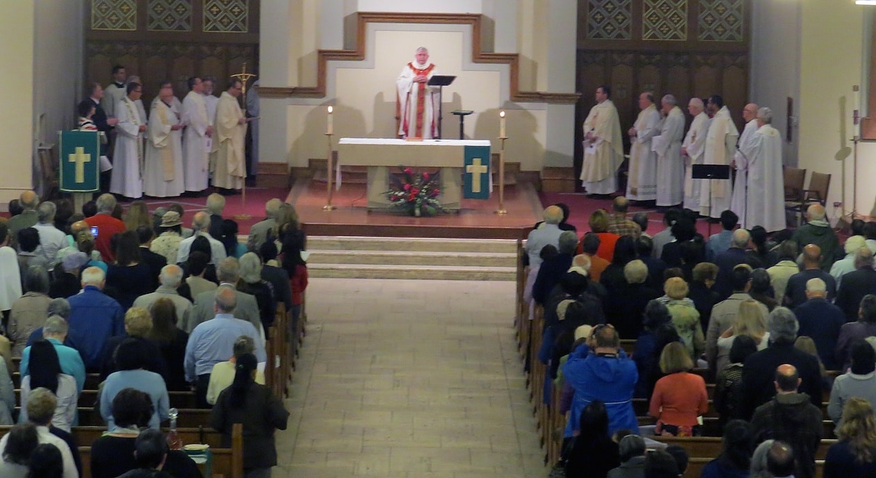 Cardinal Thomas Collins greets the congregants after the proecessional.