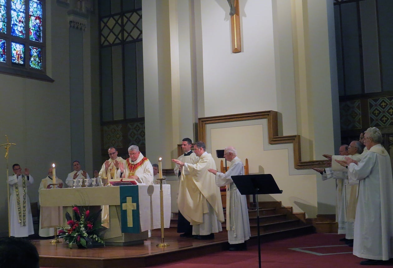 Cardinal Thomas Collins of Toronto is joined by the Paulists priests present in the Prayer of Consecration.