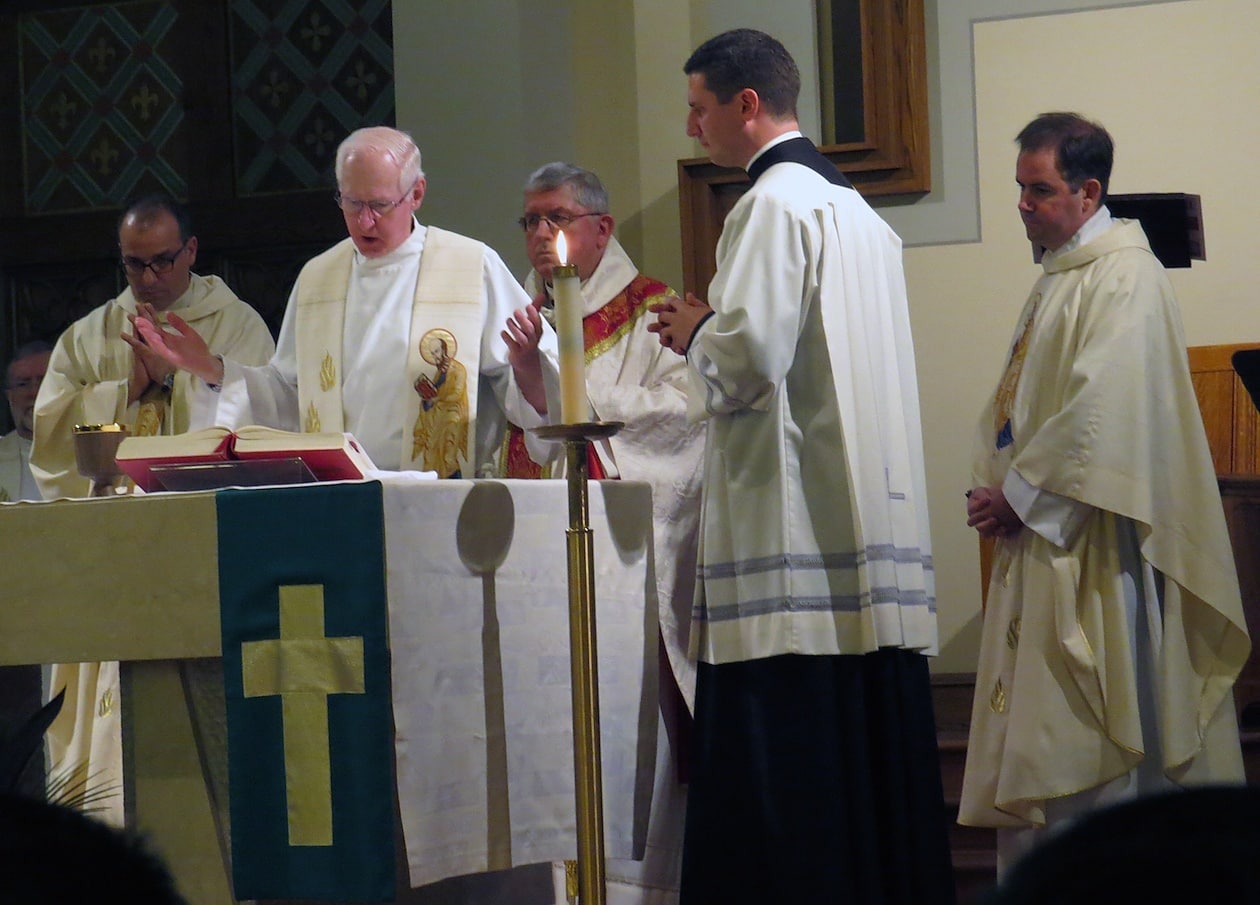 Father Jim Haley, CSP, a native of Halifax, Nova Scotia and former pastor at St. Peter’s, says part of the Eucharistc prauer.