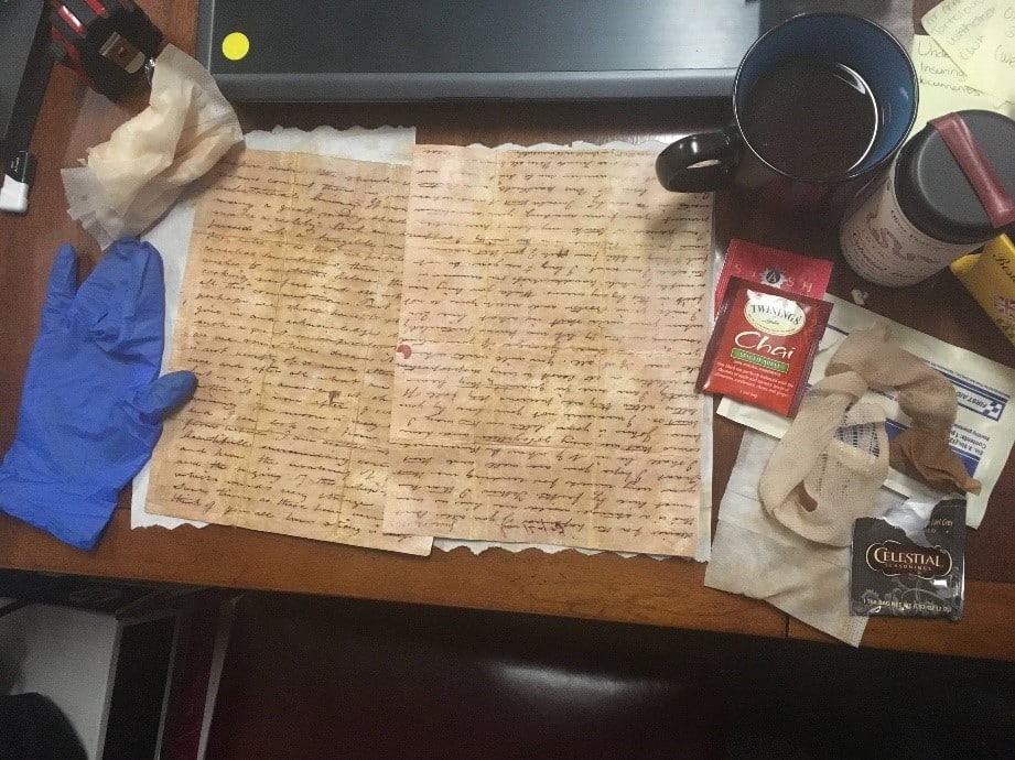 Figure 4: Twinings Spiced Apple Chai Tea provided the reddish tint, Celestial Seasons Victorian Earl Grey provided the base brown color and the gauze pad and strip created the age spots on the letters.