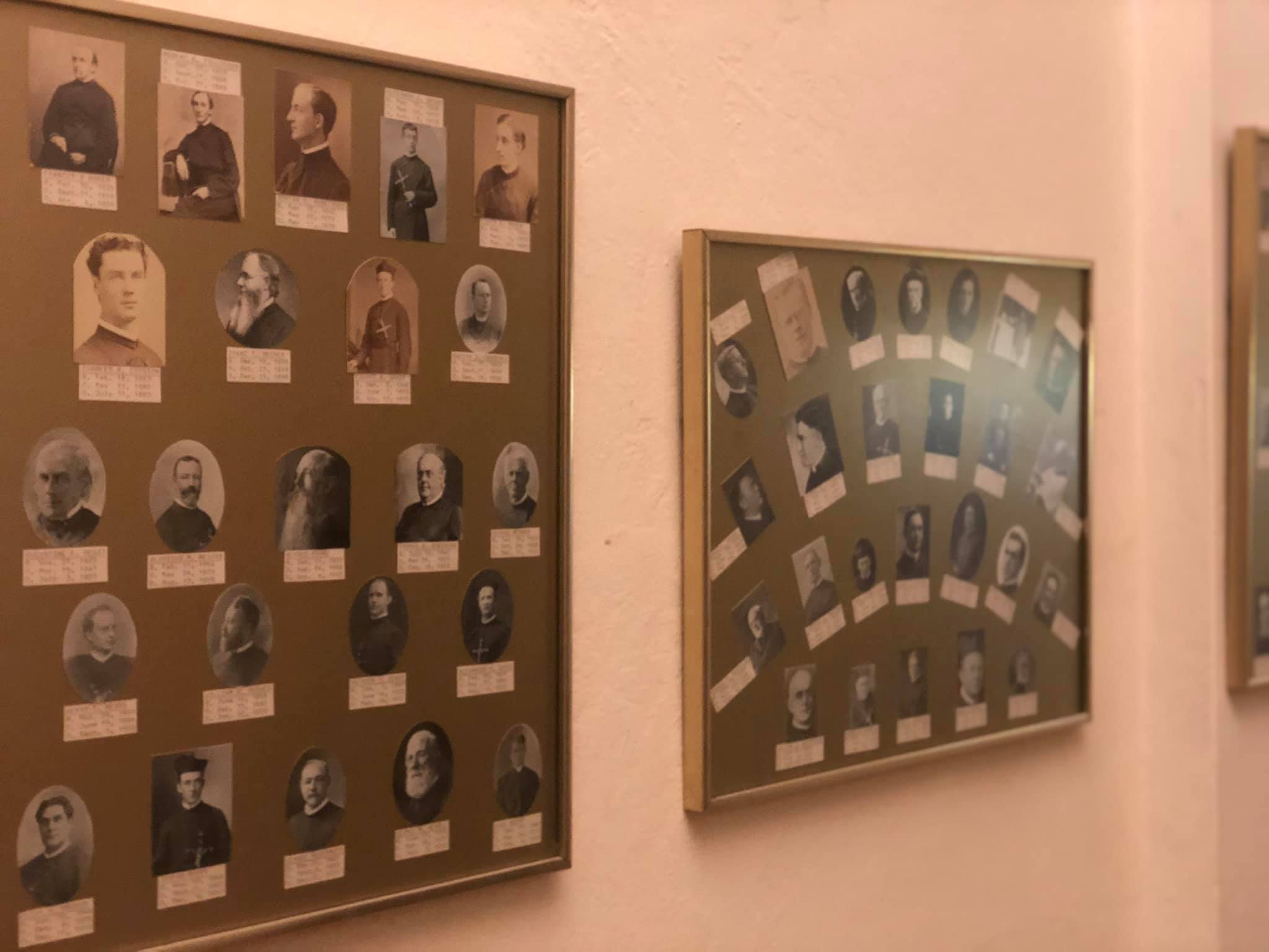 Photos of Paulists who have entered eternal life on display at the Paulist Motherhouse in New York.